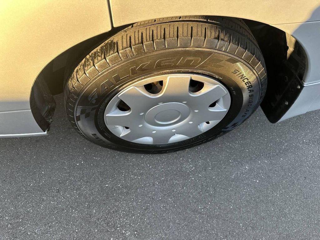 used 2014 Nissan Quest car, priced at $5,000