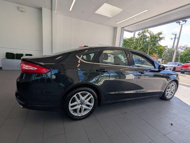 used 2013 Ford Fusion car, priced at $5,000