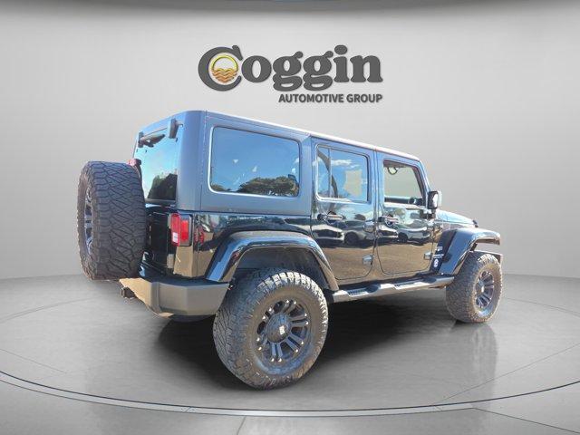 used 2016 Jeep Wrangler Unlimited car, priced at $16,291