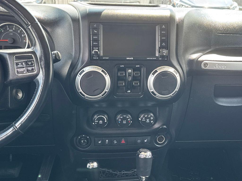 used 2013 Jeep Wrangler Unlimited car, priced at $18,196