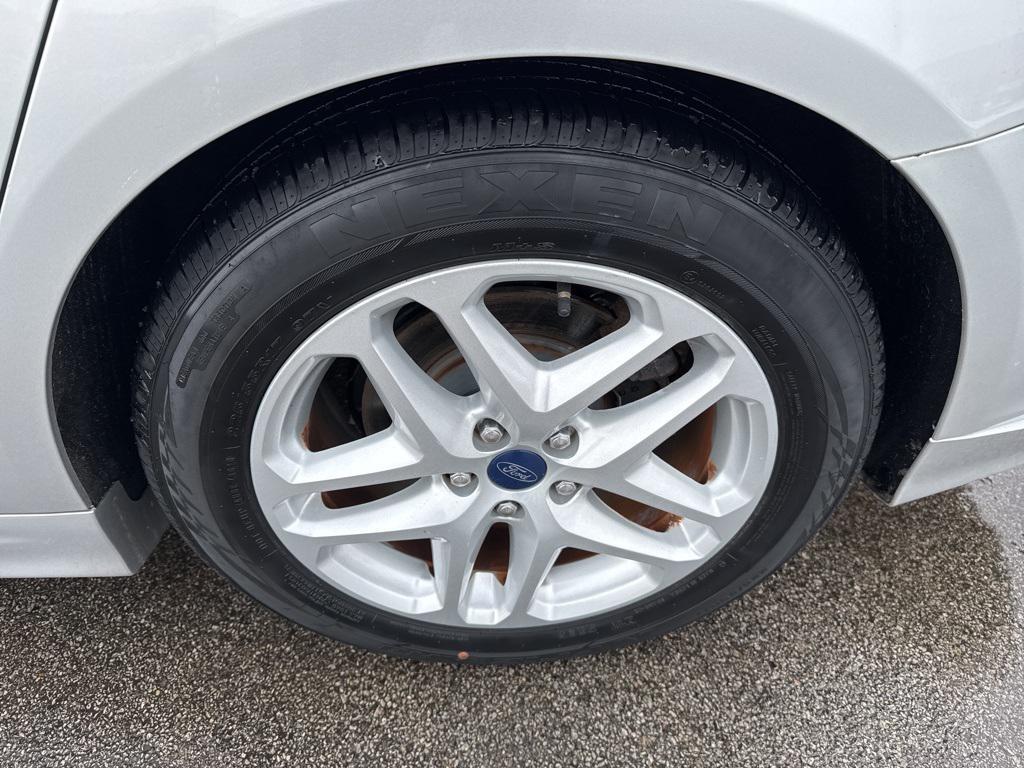 used 2015 Ford Fusion car, priced at $10,000
