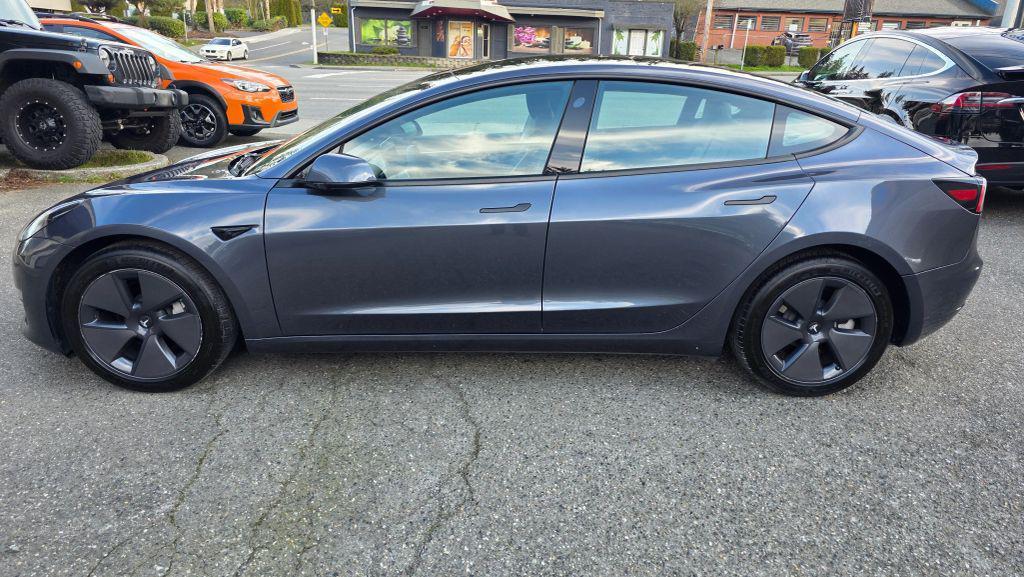 used 2023 Tesla Model 3 car, priced at $19,997
