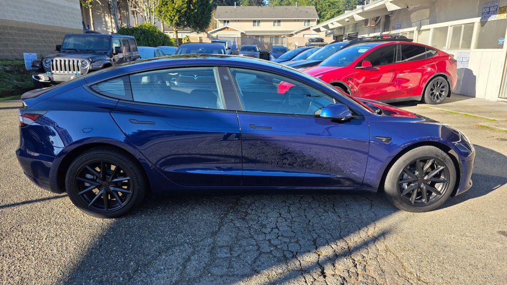 used 2023 Tesla Model 3 car, priced at $20,995
