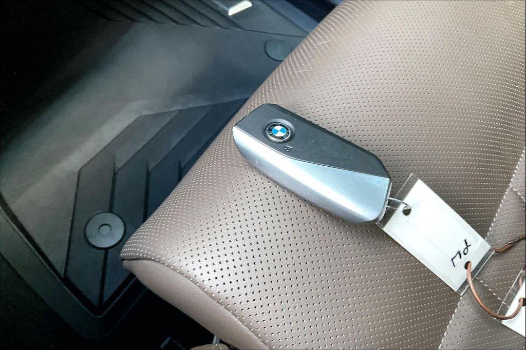 used 2025 BMW 550e car, priced at $68,338