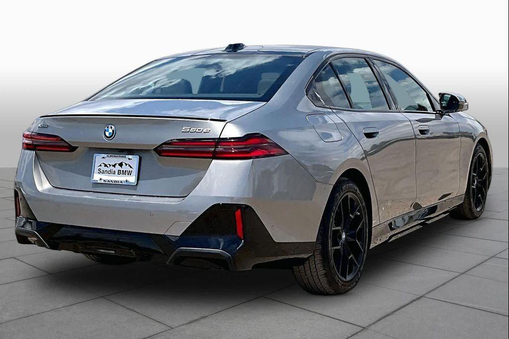 used 2025 BMW 550e car, priced at $68,338