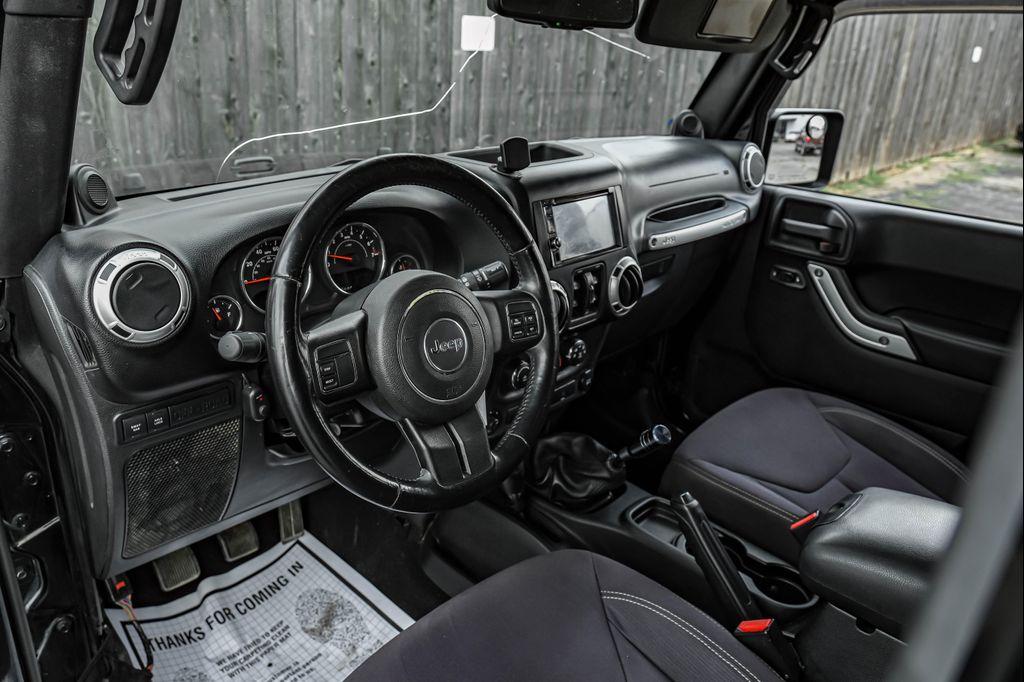 used 2013 Jeep Wrangler Unlimited car, priced at $12,495