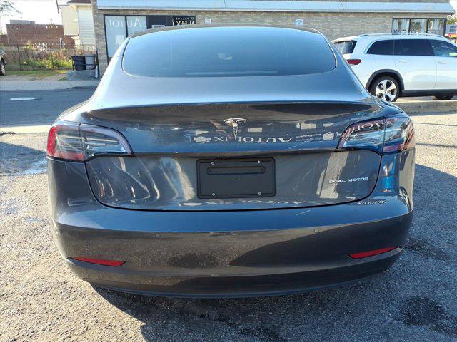 used 2022 Tesla Model 3 car, priced at $17,495
