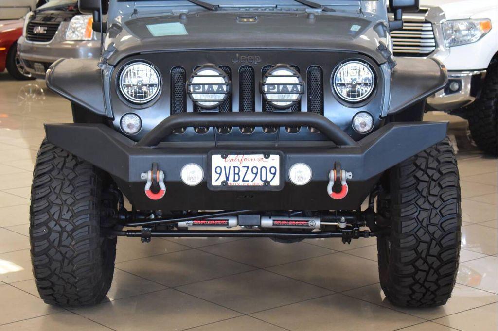 used 2014 Jeep Wrangler Unlimited car, priced at $23,997