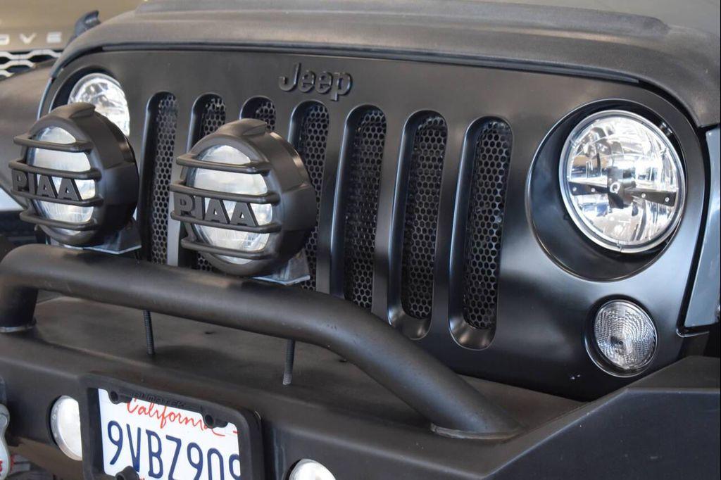 used 2014 Jeep Wrangler Unlimited car, priced at $23,997
