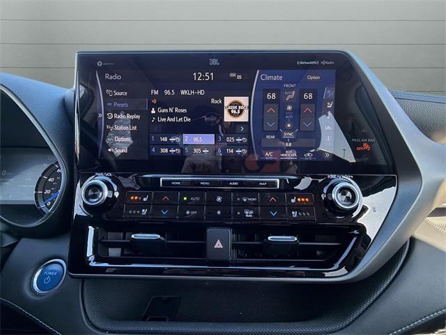 used 2021 Toyota Highlander Hybrid car, priced at $28,740