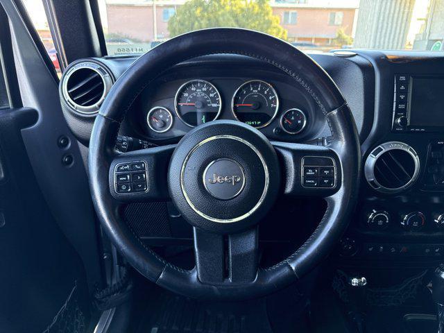 used 2015 Jeep Wrangler Unlimited car, priced at $15,491