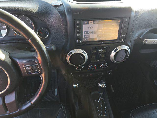 used 2015 Jeep Wrangler Unlimited car, priced at $16,493