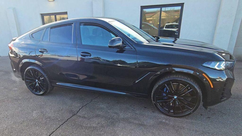 used 2025 BMW X6 car, priced at $84,994
