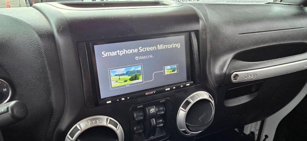 used 2015 Jeep Wrangler Unlimited car, priced at $15,995