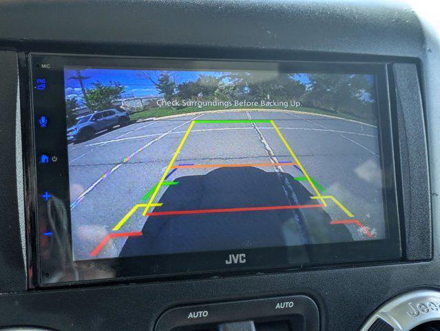 used 2015 Jeep Wrangler Unlimited car, priced at $16,668