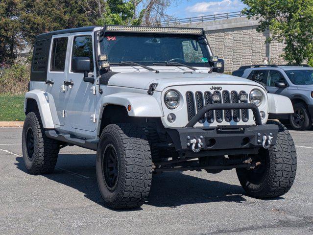 used 2015 Jeep Wrangler Unlimited car, priced at $16,668