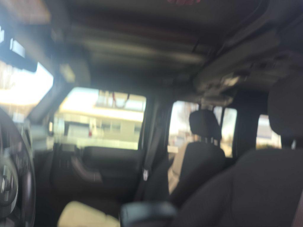 used 2013 Jeep Wrangler Unlimited car, priced at $17,900