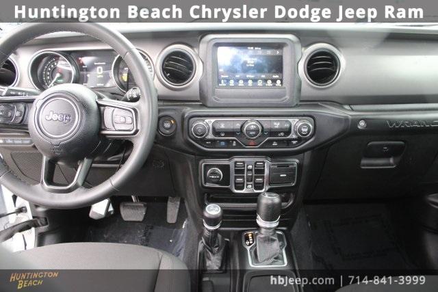 used 2023 Jeep Wrangler 4xe car, priced at $24,934