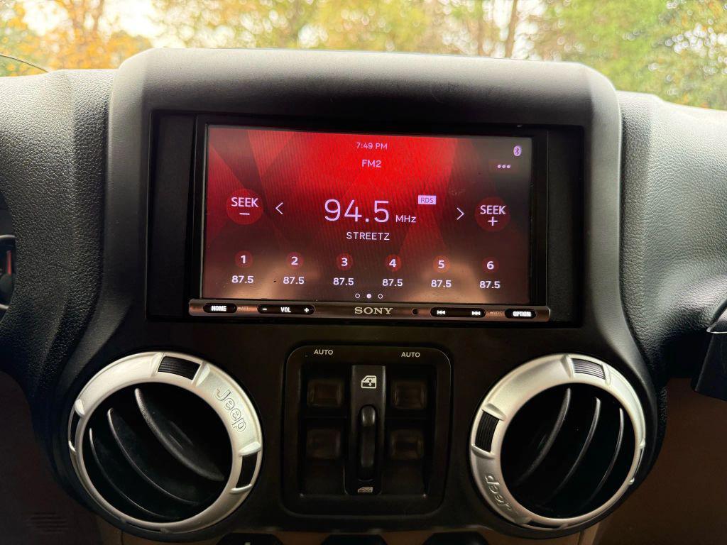 used 2012 Jeep Wrangler Unlimited car, priced at $13,499