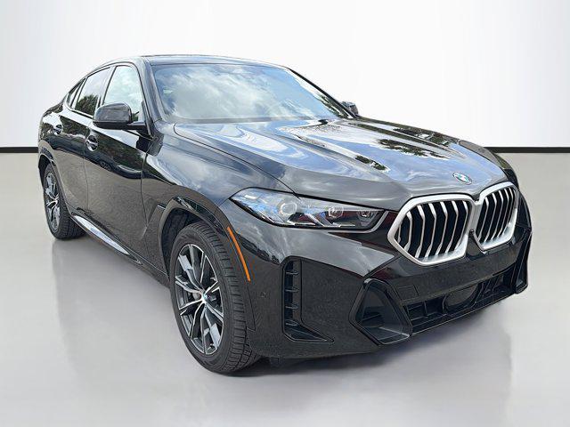 used 2025 BMW X6 car, priced at $52,352