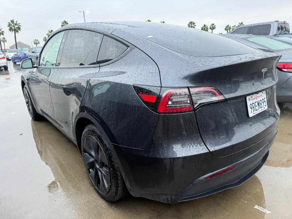 used 2025 Tesla Model Y car, priced at $37,277