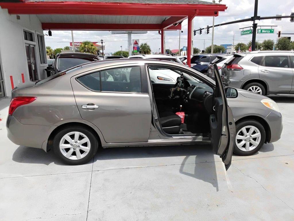 used 2012 Nissan Versa car, priced at $2,900