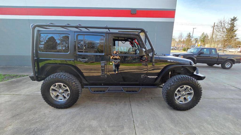 used 2014 Jeep Wrangler Unlimited car, priced at $16,495