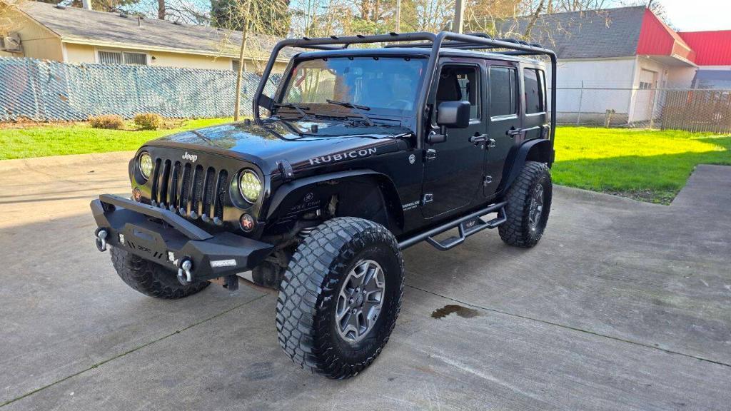 used 2014 Jeep Wrangler Unlimited car, priced at $16,495