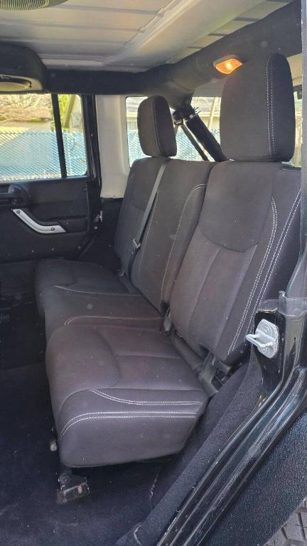 used 2014 Jeep Wrangler Unlimited car, priced at $16,495