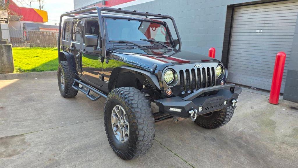 used 2014 Jeep Wrangler Unlimited car, priced at $16,495