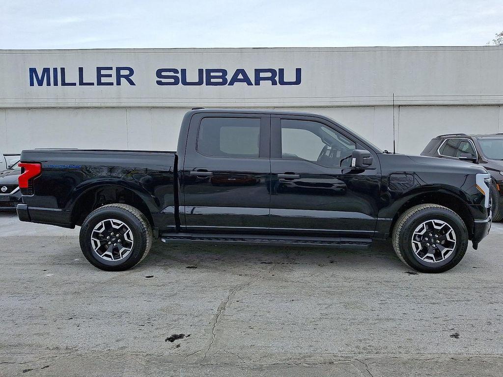 used 2023 Ford F-150 Lightning car, priced at $35,690