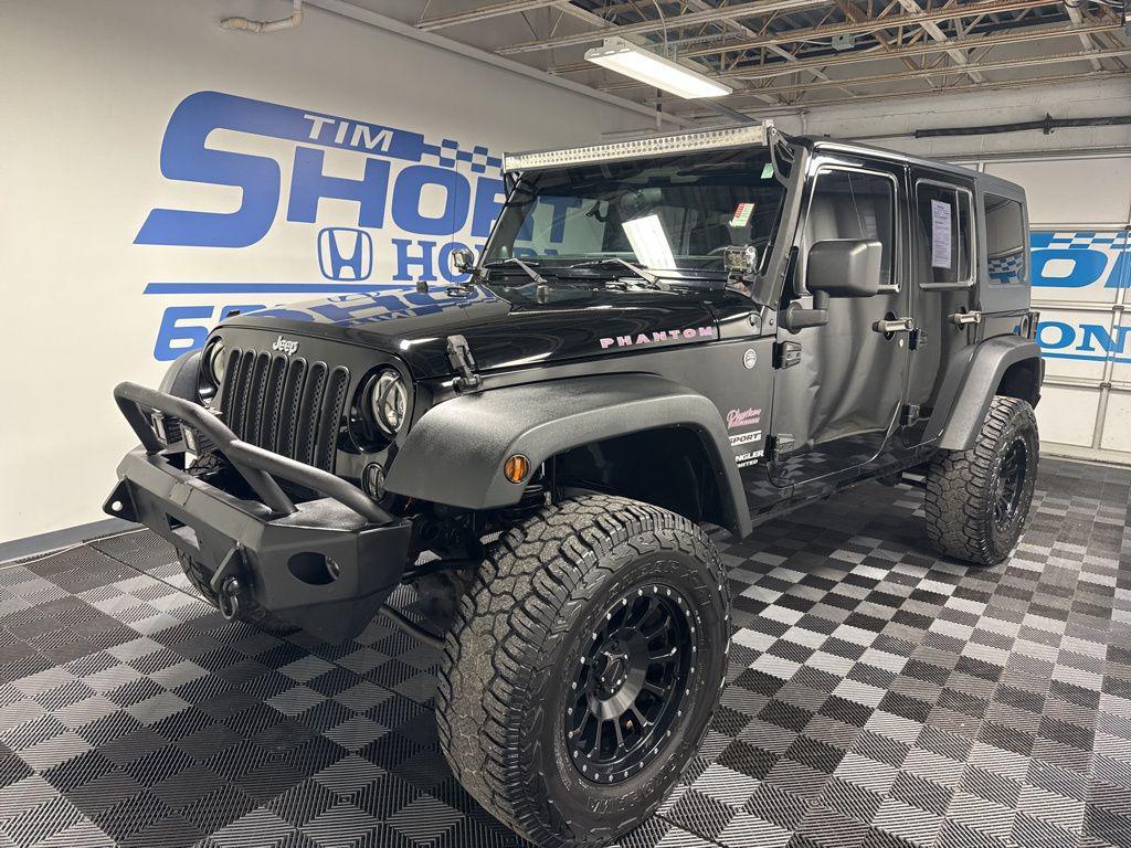 used 2014 Jeep Wrangler Unlimited car, priced at $13,245