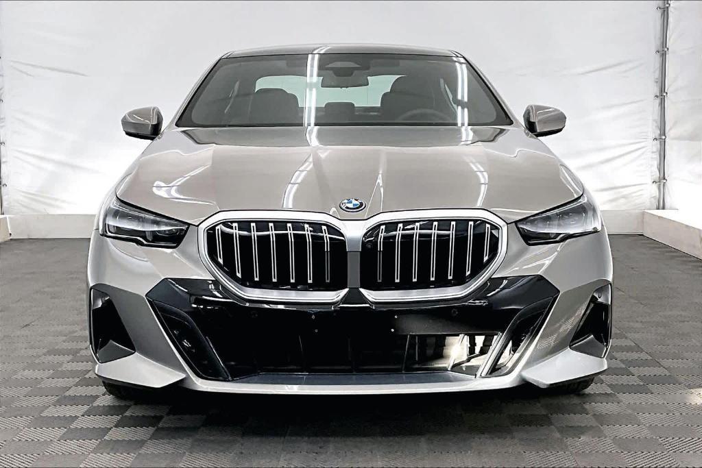 used 2025 BMW 550e car, priced at $74,625