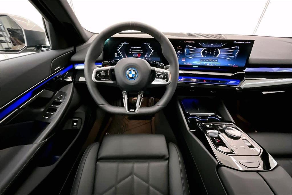 used 2025 BMW 550e car, priced at $74,625