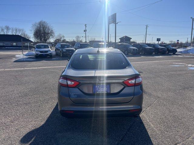 used 2014 Ford Fusion car, priced at $5,000