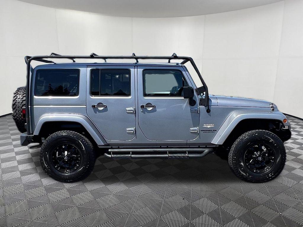 used 2013 Jeep Wrangler Unlimited car, priced at $14,597