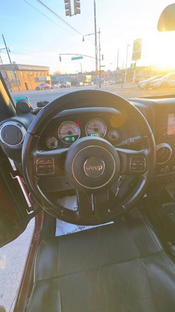 used 2012 Jeep Wrangler Unlimited car, priced at $16,488