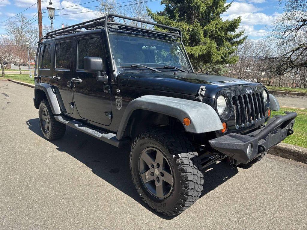 used 2011 Jeep Wrangler Unlimited car, priced at $9,991
