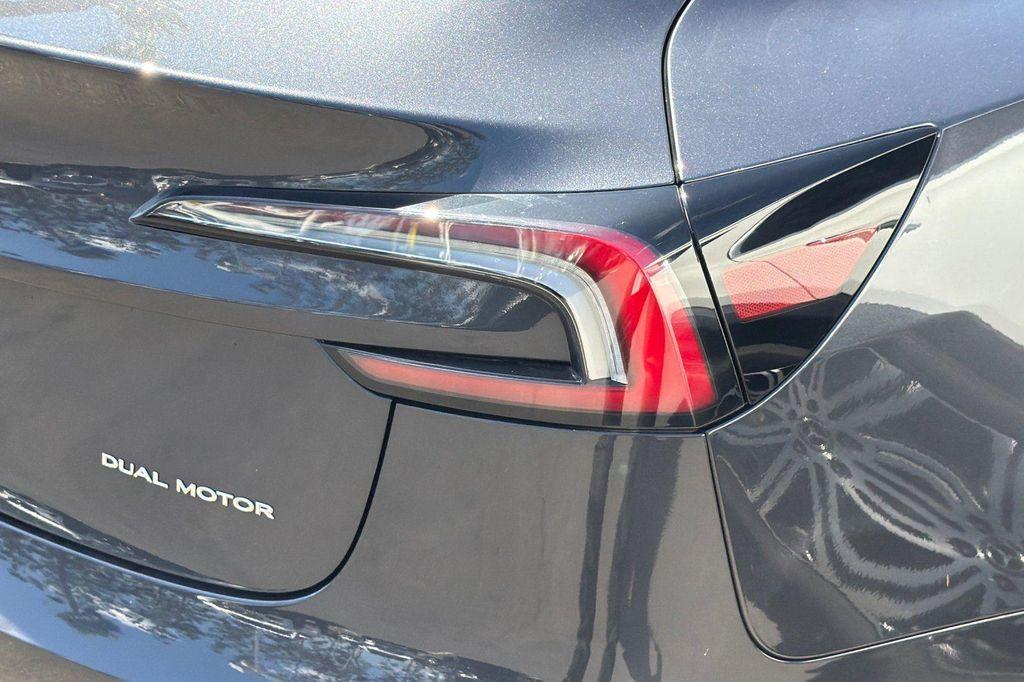 used 2025 Tesla Model 3 car, priced at $40,854