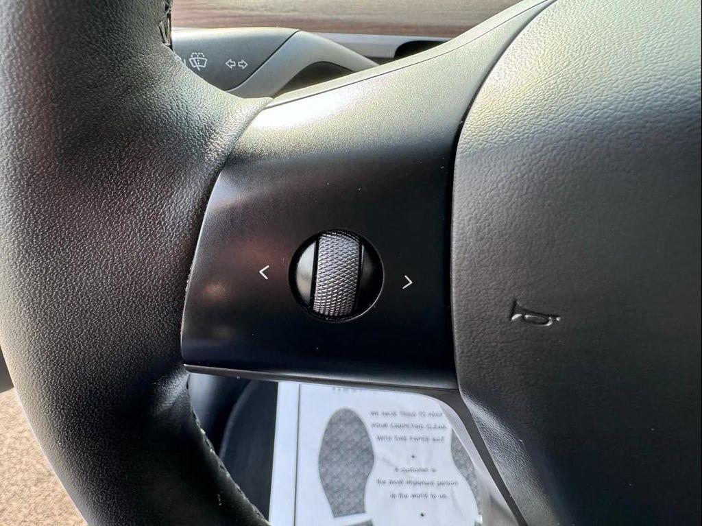 used 2025 Tesla Model Y car, priced at $34,494