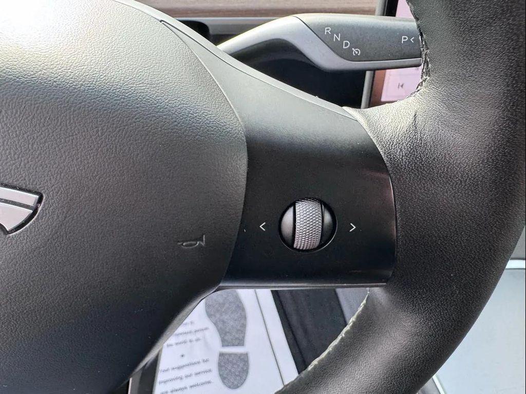 used 2025 Tesla Model Y car, priced at $34,494