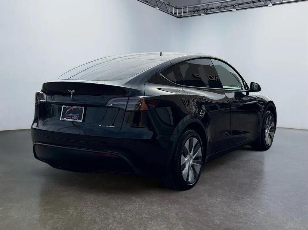 used 2025 Tesla Model Y car, priced at $34,494