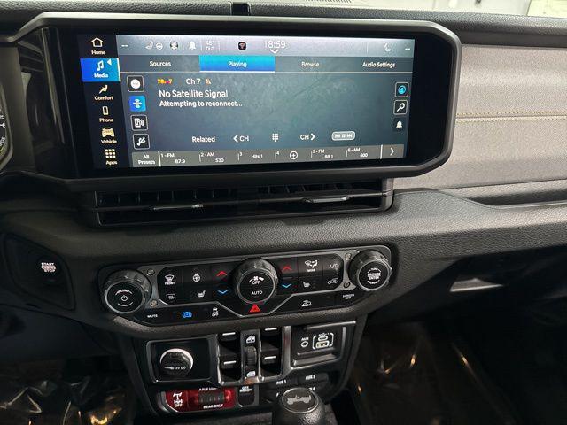 used 2024 Jeep Wrangler 4xe car, priced at $30,558