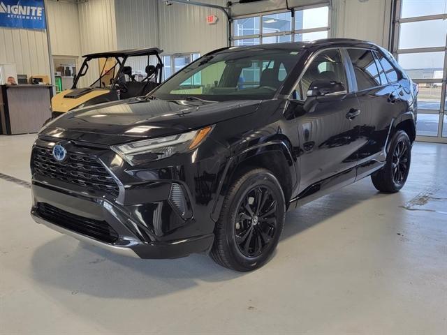 used 2023 Toyota RAV4 Hybrid car, priced at $30,000