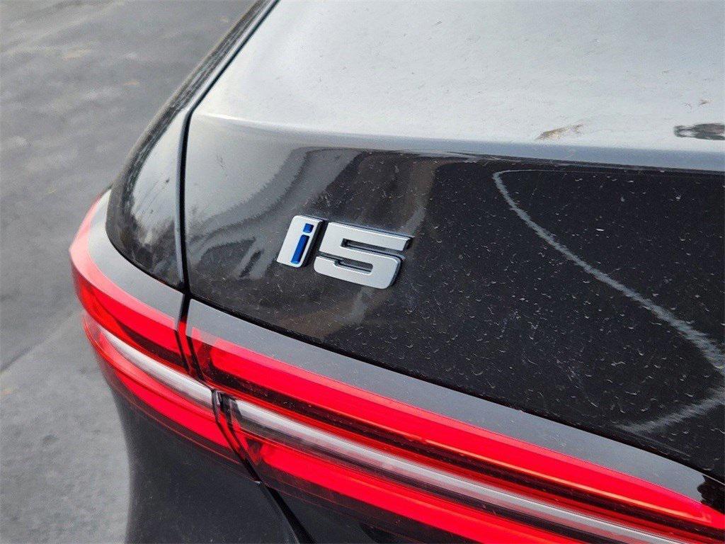 used 2025 BMW i5 car, priced at $59,994