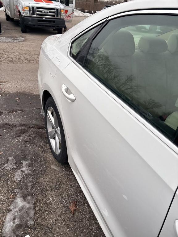 used 2013 Volkswagen Passat car, priced at $6,903