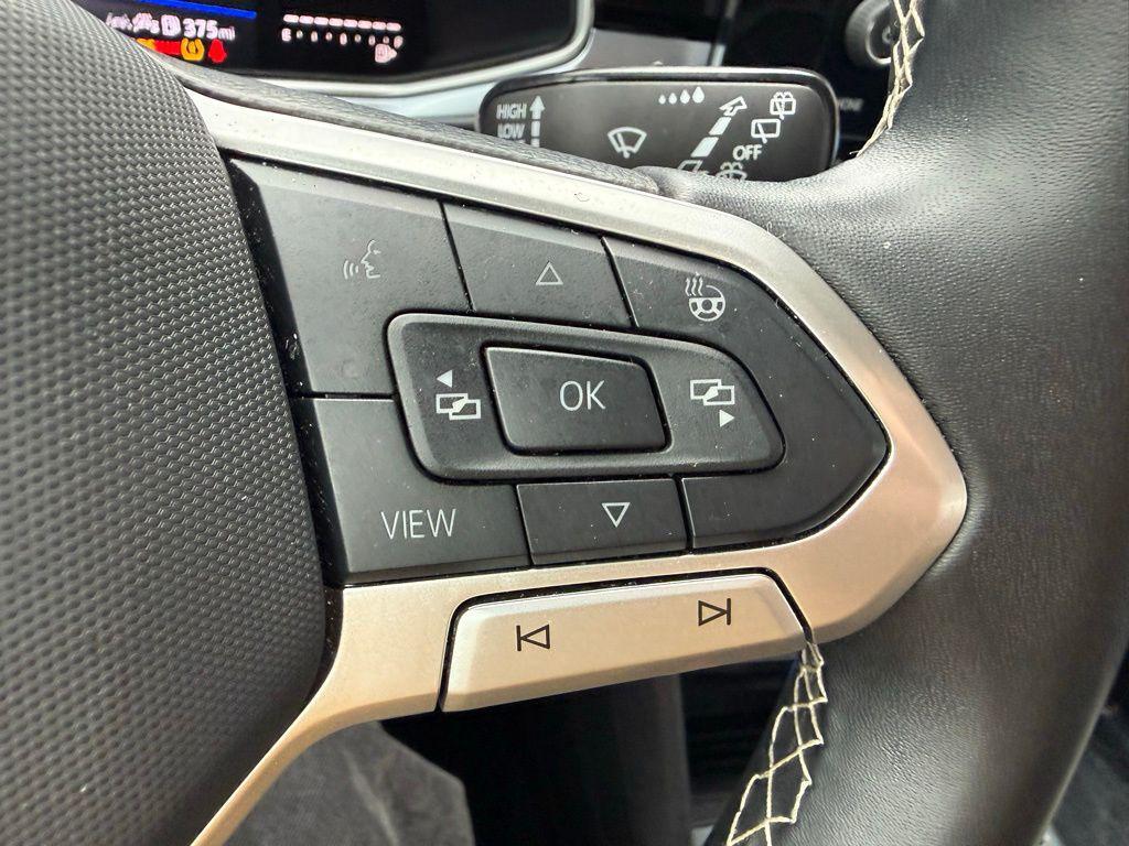 used 2025 Volkswagen Taos car, priced at $22,500