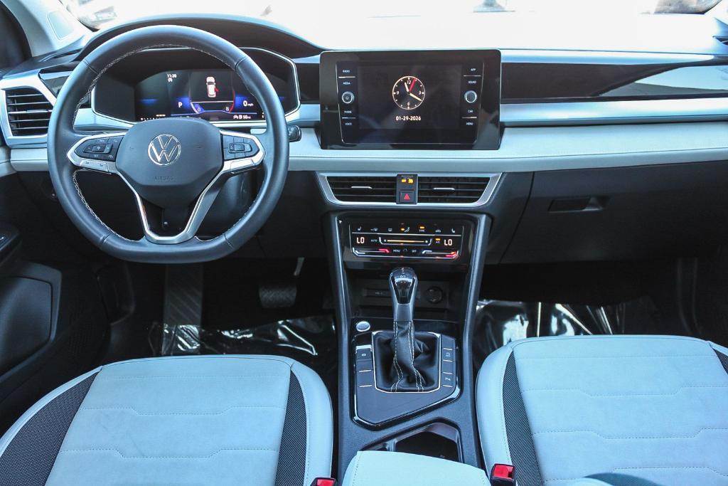 used 2025 Volkswagen Taos car, priced at $25,174