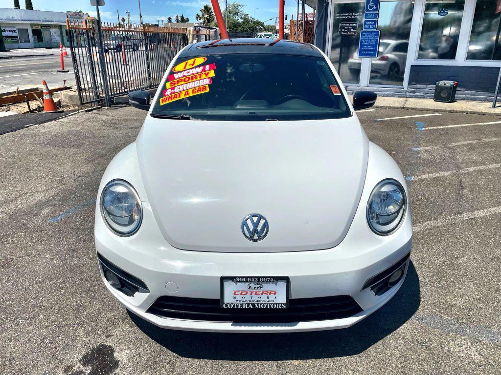 2014 White Volkswagen Beetle