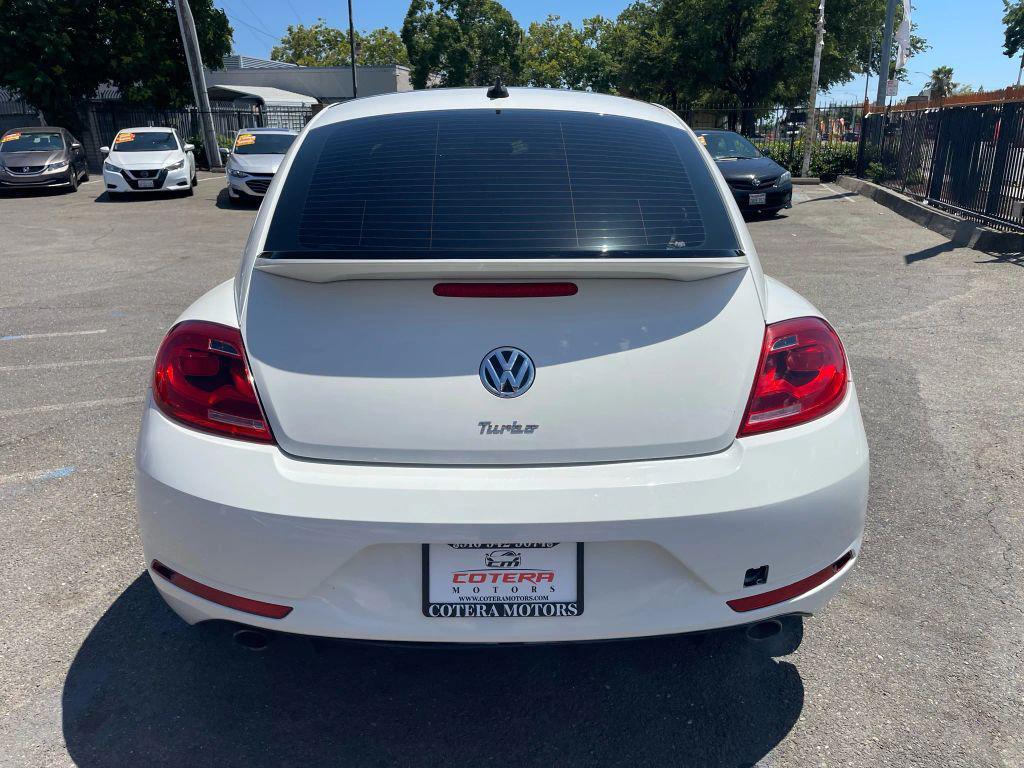 2014 White Volkswagen Beetle